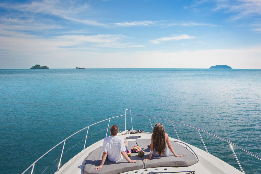 Luxury cruise travel on the yacht, romantic honeymoon vacation for two on the sea beach
