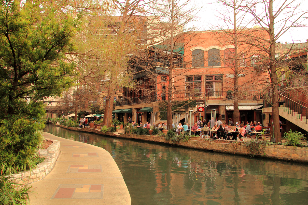 a hotel or restaurant by the San Antonio River Walk
