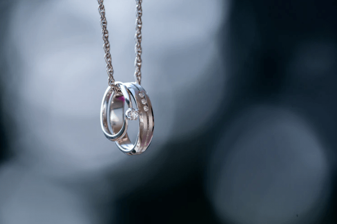 silver necklace and rings